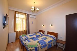 Postel nebo postele na pokoji v ubytování Villa Rosa