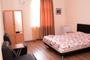 Postel nebo postele na pokoji v ubytování Villa Rosa