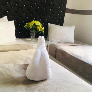 Voodi või voodid majutusasutuse Hotel velvet One toas