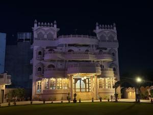 a lit up building at night at Virasat Haveli in Varanasi