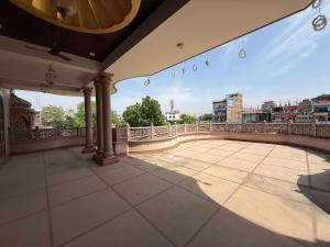 a balcony with a view of a city at Virasat Haveli in Varanasi