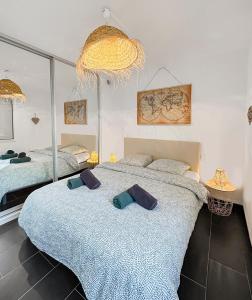 En eller flere senge i et værelse på L'Amphitrite 1 Stella vue mer