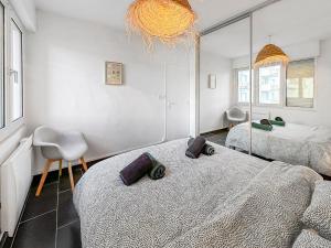 En eller flere senge i et værelse på L'Amphitrite 1 Stella vue mer