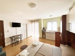a living room with a couch and a table at Apartments Vila Miranda in Vodice