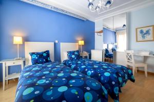 Łóżko lub łóżka w pokoju w obiekcie Hostal Adriano
