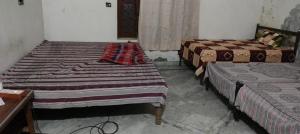 Postel nebo postele na pokoji v ubytování Nitin tyagi homestay