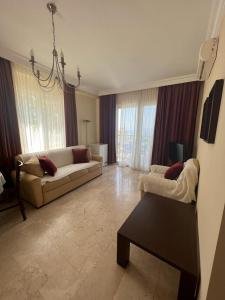 Χώρος καθιστικού στο Apartment in Goldcity tourism complex