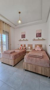 Postel nebo postele na pokoji v ubytování Appartement luxueux - Piscines, Plage 300m, Résidence fermée + 37 fotografií