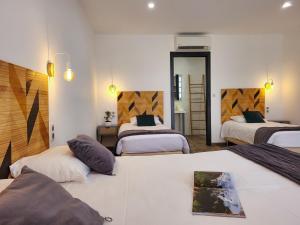 Postel nebo postele na pokoji v ubytování Hôtel Padolo + 37 fotografií