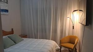 Postel nebo postele na pokoji v ubytování Hospedaje Gandía Centro