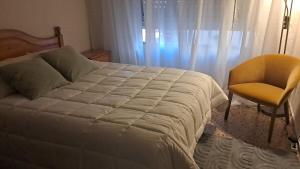 Postel nebo postele na pokoji v ubytování Hospedaje Gandía Centro