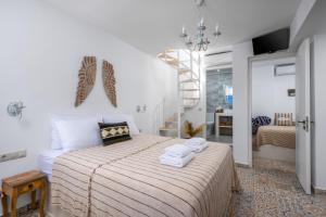 Postel nebo postele na pokoji v ubytování Hermes Seaview House