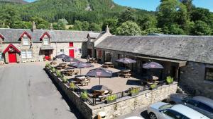 an overhead view of a building with tables and umbrellas at Faskally Woods Holiday Park in Pitlochry