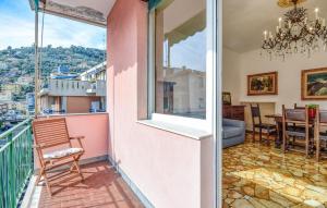 a room with a balcony with a view of a table at Gorgeous Apartment In Recco With Wifi in Recco
