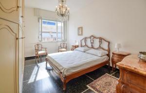 a bedroom with a bed and a table and chairs at Gorgeous Apartment In Recco With Wifi in Recco
