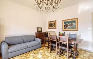 a living room with a couch and a table at Gorgeous Apartment In Recco With Wifi in Recco +11 photos