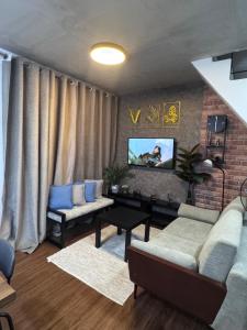 Posezení v ubytování Cozy Rustic Corner House Subic + 2 fotografie