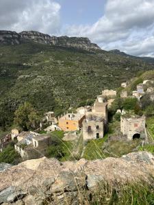 a village on the side of a mountain at Casa Rosa in Taquisara