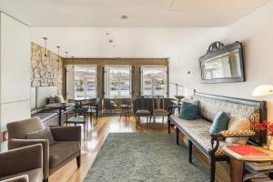 a living room with a couch and a table at 1872 River House by Olivia in Porto