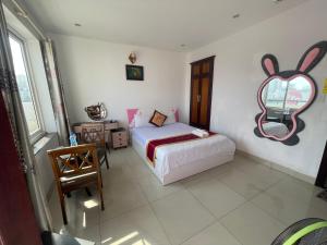 Postel nebo postele na pokoji v ubytování Đức Anh HoTel Vũng Tàu