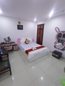 Postel nebo postele na pokoji v ubytování Đức Anh HoTel Vũng Tàu