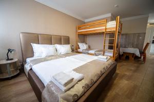 Postel nebo postele na pokoji v ubytování Hotel Zenubia