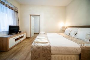 Postel nebo postele na pokoji v ubytování Hotel Zenubia
