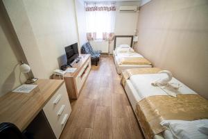 Postel nebo postele na pokoji v ubytování Hotel Zenubia