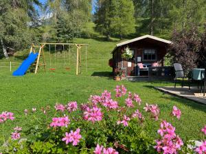 a backyard with a playground and a swing at Landhaus Laura in Leutasch +2 photos