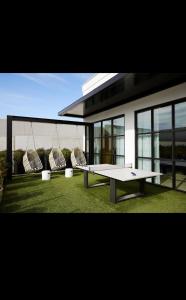 a ping pong table in front of a house at Giaviana's in Atlanta