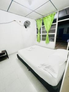 Postel nebo postele na pokoji v ubytování Hotel el capricho