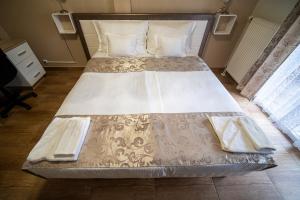 Postel nebo postele na pokoji v ubytování Hotel Zenubia