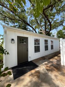 a white garage with a row of windows at Luxury BoilingSprings Getaway in Boiling Springs