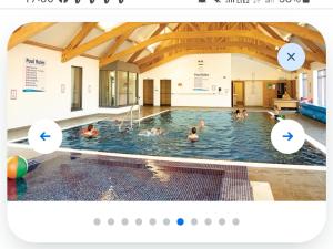 a group of people in a swimming pool at 3 bed 2 bath Static on parkdean morecambe in Morecambe