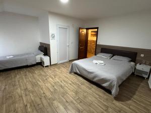 Ένα ή περισσότερα κρεβάτια σε δωμάτιο στο Hotel Palma