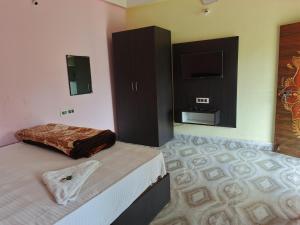 BLISS view RESORT客房内的一张或多张床位