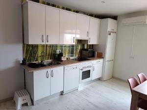 a kitchen with white cabinets and a sink at Apartamento La Bella Vista ATBA00361 in Zafra +38 photos