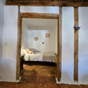 a bedroom with a bed in a white room at Casa Rural Kristina 2 Estrellas in Retuerta +131 photos