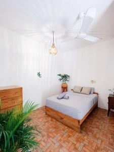 a bedroom with a bed in a room at Green Studio at Casa Cacao with Terrace and Starlink in Brisas de Zicatela