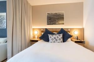 Ein Bett oder Betten in einem Zimmer der Unterkunft 2012 New Apt with Pool and Gym in front of Kaseya Center