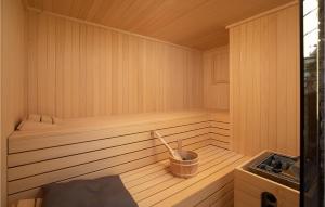 a sauna with a bucket in the middle of it at Amazing Home In Pula With Sauna in Pula