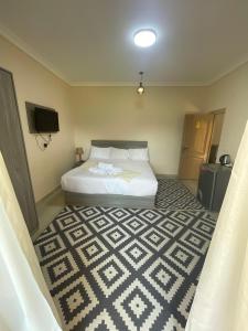 Voodi või voodid majutusasutuse Jazal Pyramids View Hotel toas