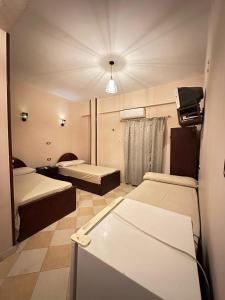 Postel nebo postele na pokoji v ubytování Kilani Hotel Siwa فندق كيلاني سيوة