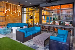a restaurant with blue chairs and a bar at Tranquil Stay Near Monuments and Metro in Alexandria +24 photos