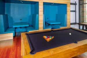 a pool table in a room with blue walls at Tranquil Stay Near Monuments and Metro in Alexandria