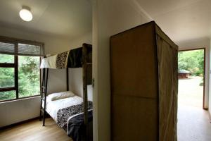 Postel nebo postele na pokoji v ubytování Ubuntu Hikers Cabin + 1 fotografie