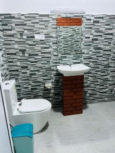 Uma casa de banho em Unic Residence And Transit Hotel