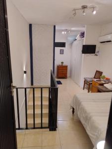 Postel nebo postele na pokoji v ubytování Bungalow Turrent, a 5 minutos de playa Mocambo