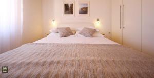 Łóżko lub łóżka w pokoju w obiekcie Apartment-Gordana