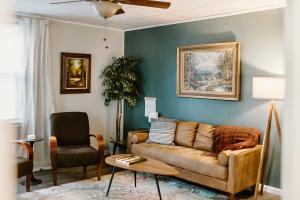 a living room with a couch and a chair at Spacious Home Near Lake MI w Fire Pit in Sheboygan